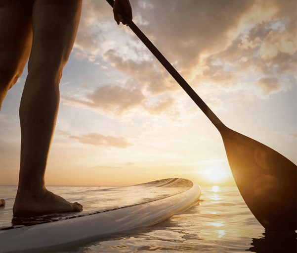 Paddle-boarder braving the Channel for a beautiful view